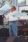 Photo of Scott Mullins, emceeing the 1998 Louisville BLues Festival on Theater Square