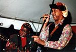 Photo of Ron Lewis, guitar, Izzy Sutton, vocals, Mr. Wonderful Production Band, 10th Street Blues Festival, June 10, 2006 